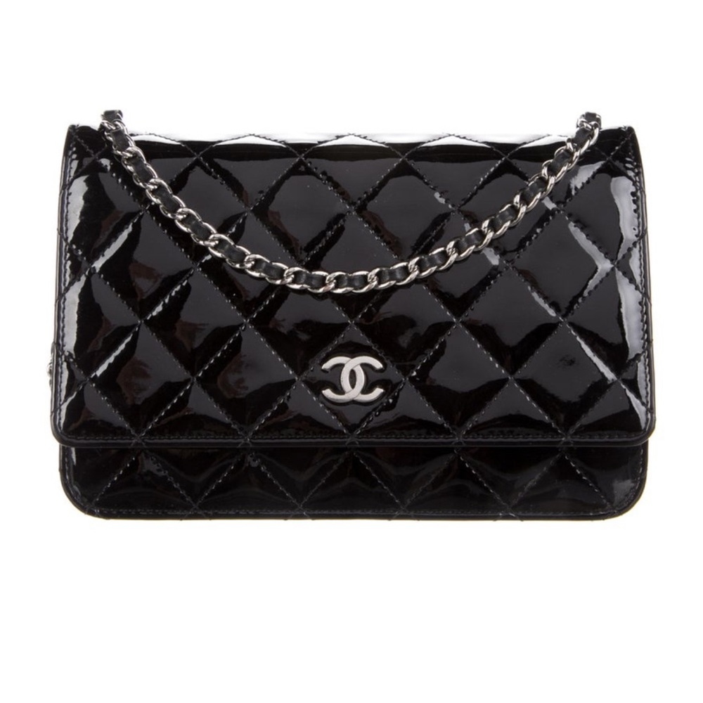 Black classic Chanel patent leather wallet on chain.
